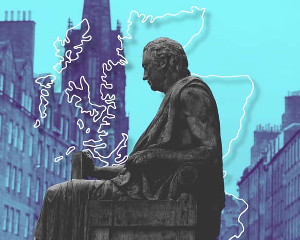 A statue of David Hume against the backdrop of Edinburgh's Old Town