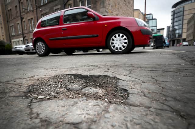 Edinburgh's streets have become littered with potholes of various sizes in recent years (Picture: Jane Barlow)