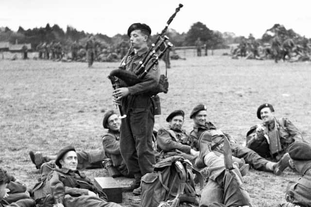 Piper Bill Millin, seen later, played 'Hielan' Laddie' and 'The Road to the Isles' as British soldiers landed on Sword beach on D-Day (Picture: Galerie Bilderwelt)