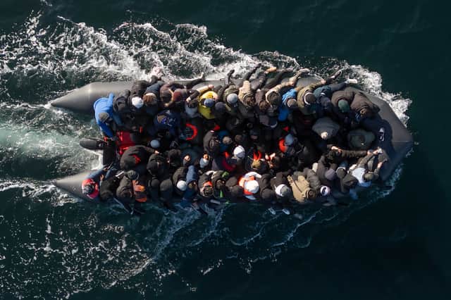 An inflatable dinghy carrying migrants crosses the English Channel (Picture: Dan Kitwood)