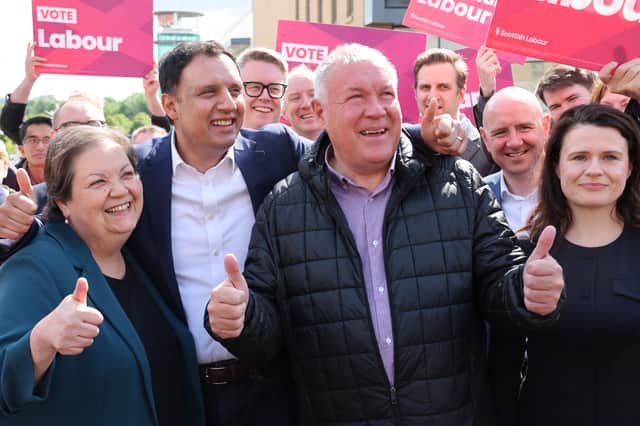 Scottish Labour deputy leader Jackie Baillie, the party's leader Anas Sarwar and Davy Russell celebrate during a rally on Castle Street, Hamilton, after he was declared the winner for the Hamilton, Larkhall and Stonehouse by-election
