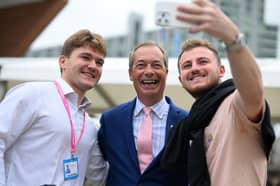 Delegates at the Conservative party conference in 2023 pose for a photograph with Nigel Farage (Picture: Oli Scarff)