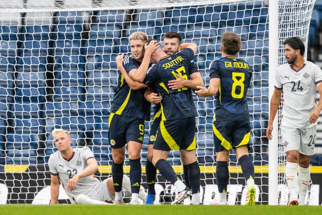 Scotland's John Souttar (C) celebrates with George Hirst, Grant Hanley and Billy GIlmour (L-R) after scoring to make it 1-1 against Iceland at Hampden. (Photo by Alan Harvey / SNS Group)