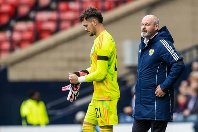 Steve Clarke watches on as Cieran Slicker makes his Scotland debut.
