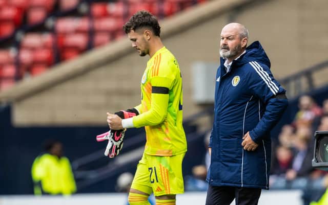 Steve Clarke watches on as Cieran Slicker makes his Scotland debut.