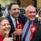 Labour candidate Davy Russell wins  the by-election and celebrates alongside party leader Anas Sarwar and his deputy Jackie Baillie.