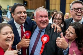 Labour candidate Davy Russell wins  the by-election and celebrates alongside party leader Anas Sarwar and his deputy Jackie Baillie.