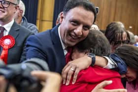 Anas Sarwar, leader of the Scottish Labour party, celebrates with deputy leader Jackie Baillie.
