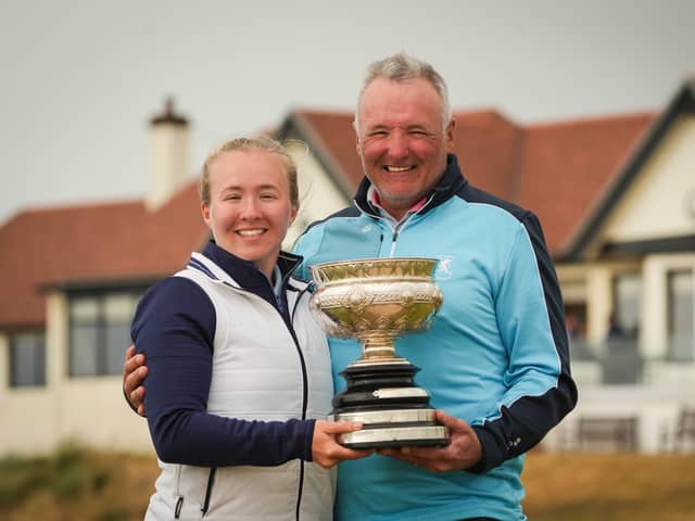 East Kilbride’s Susan Woodhouse shows off the trophy along with her dad Douglas after winning the 2025 Scottish Women's Amateur at Western Gailes 
