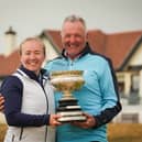 East Kilbride’s Susan Woodhouse shows off the trophy along with her dad Douglas after winning the 2025 Scottish Women's Amateur at Western Gailes 