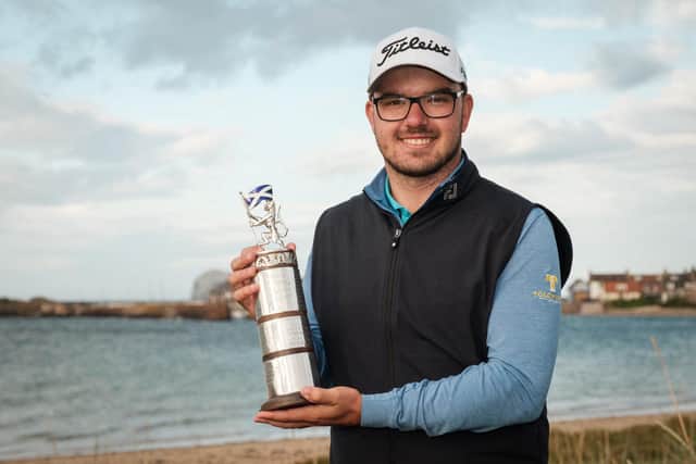Elliot Baker shows off the trophy after winning the Scottish Men’s Open at North Berwick