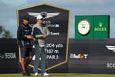 Scottie Scheffler talks with his caddie Ted Scott during the 2022 Genesis Scottish Open at The Renaissance Club 