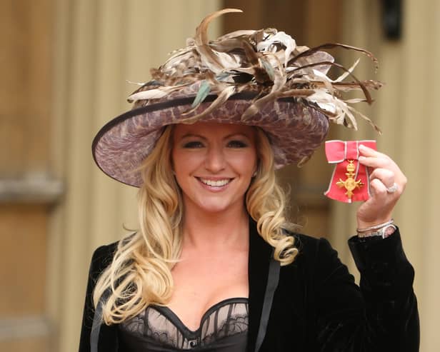 Michelle Mone shows off her OBE, awarded at an investiture ceremony at Buckingham Palace in 2010 (Picture: Dominic Lipinski/WPA pool)