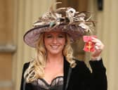 Michelle Mone shows off her OBE, awarded at an investiture ceremony at Buckingham Palace in 2010 (Picture: Dominic Lipinski/WPA pool)