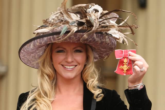 Michelle Mone shows off her OBE, awarded at an investiture ceremony at Buckingham Palace in 2010 (Picture: Dominic Lipinski/WPA pool)