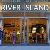 Hundreds of jobs are at risk at River Island as part of plans to shut 33 of its UK stores.