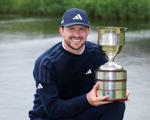 Connor Syme shows off the trophy after landing his maiden DP World Tour win in the KLM Open at The International Golfclub in Badhoevedorp