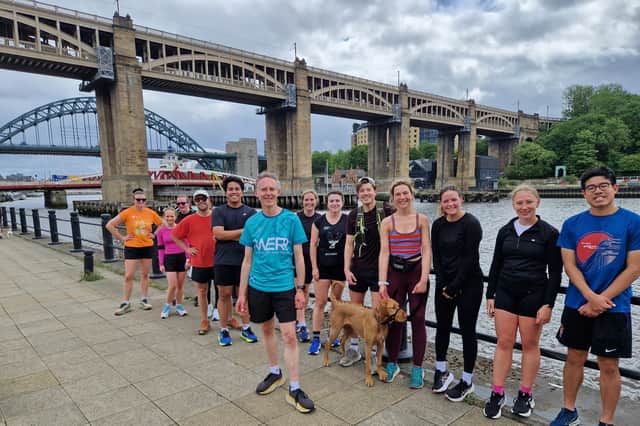 Alastair Dalton with the Croissant Run Club beside the Tyne in Newcastle