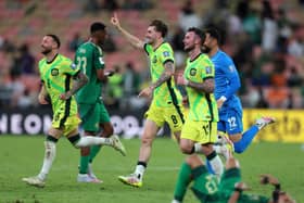 Hibs winger Martin Boyle (left) celebrates Australia's win over Saudi Arabia and subsequent qualification for the 2026 World Cup with teammates Connor Metcalfe and Aiden O'Neill at King Abdullah Sports City in Jeddah. (Photo by Yasser Bakhsh/Getty Images)