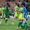 Hibs winger Martin Boyle (left) celebrates Australia's win over Saudi Arabia and subsequent qualification for the 2026 World Cup with teammates Connor Metcalfe and Aiden O'Neill at King Abdullah Sports City in Jeddah. (Photo by Yasser Bakhsh/Getty Images)