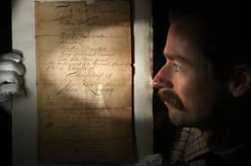 Tommy Alexander, valuer at Great Western Auctions, with the newly discovered handwritten original manuscript of a poem by Scottish Enlightenment poet Allan Ramsay (1684-1758), which is expected to fetch £800 - £1,200 at GWA Summer Two Day Fine Art & Antiques Auction on Friday and Saturday.