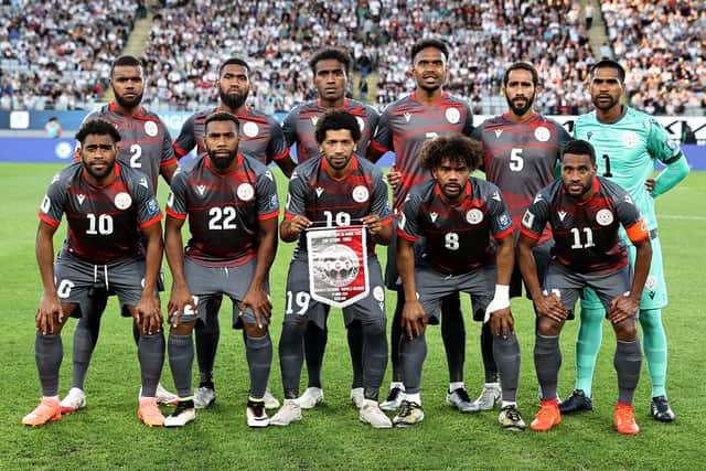 New Caledonia players pose before the 2026 World Cup Oceania qualifiers group final match against New Zealand at Eden Park Stadium in Auckland on March 24, 2025. (Photo by DAVID ROWLAND/AFP via Getty Images)