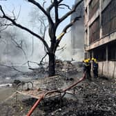 Firefighters work at the site of an airplane that crashed in India's north-western city of Ahmedabad. Picture: AP Photo/Ajit Solanki