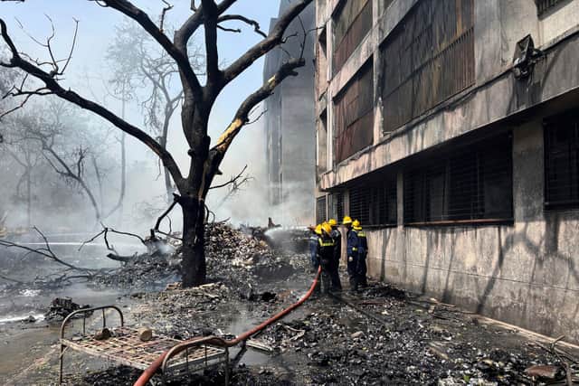 Firefighters work at the site of an airplane that crashed in India's north-western city of Ahmedabad. Picture: AP Photo/Ajit Solanki