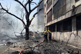 Firefighters work at the site of an airplane that crashed in India's north-western city of Ahmedabad. Picture: AP Photo/Ajit Solanki