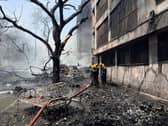 Firefighters work at the site of an airplane that crashed in India's north-western city of Ahmedabad. Picture: AP Photo/Ajit Solanki