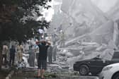 People look over damage to buildings in Nobonyad Square following Israeli airstrikes in Tehran, Iran. Iran's three top military generals were killed in the attacks that also targeted nuclear and military facilities