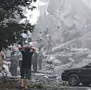 People look over damage to buildings in Nobonyad Square following Israeli airstrikes in Tehran, Iran. Iran's three top military generals were killed in the attacks that also targeted nuclear and military facilities