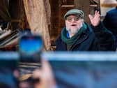 Director Guillermo del Toro waving to fans while filming Frankenstein in Edinburgh in 2024. 