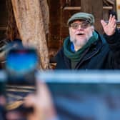Director Guillermo del Toro waving to fans while filming Frankenstein in Edinburgh in 2024. 