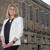 National Library of Scotland chief executive Amina Shah in front of the building.