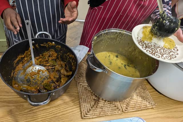 Dhal and aubergine curry being served at the Glasgow pop-up public diner meal