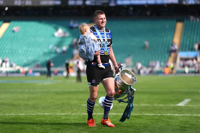 Finn Russell with daughter Skye after helping Bath beat Leicester in the Gallagher Premiership final at the Allianz Stadium at Twickenham on Saturday.