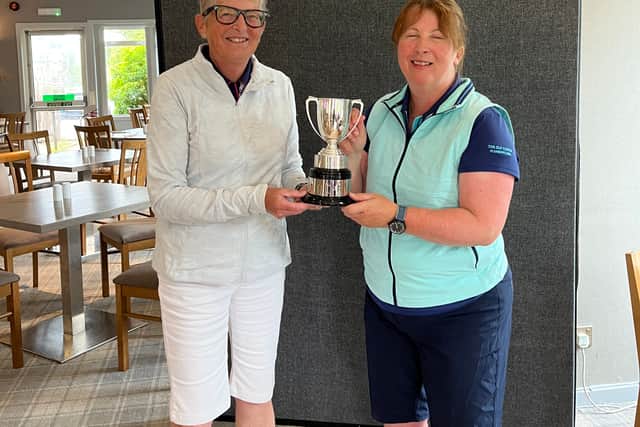 Elaine Moffat, right, is presented with the trophy by captain Morag Wardrop after winning the Scottish Senior Women’s Golf Association Midland Championship at Muckhart