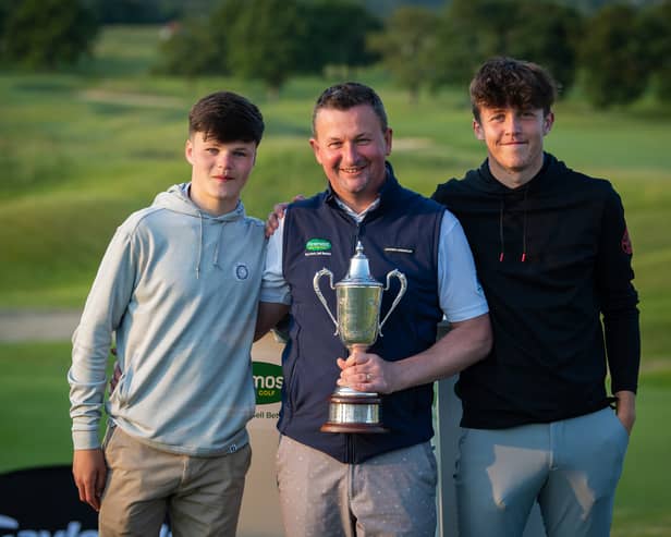 Gourock Golf Club professional Derek Watters shows off the trophy with his two sons after winning the Foremost Championship at The Oxfordshire Golf Hotel & Spa