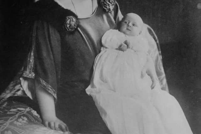 Queen Marie of Romania with one of her children.