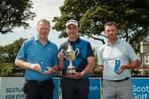 Scottish Senior Men's Open champion John Kennedy, centre, flanked by runner-up John Laurie, right, and third-placed Richard Johnston, left,  at Montrose Links 