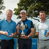 Scottish Senior Men's Open champion John Kennedy, centre, flanked by runner-up John Laurie, right, and third-placed Richard Johnston, left,  at Montrose Links 