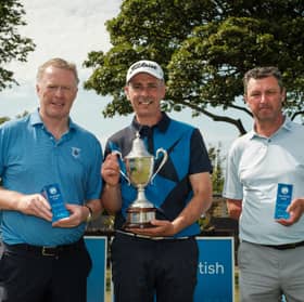 Scottish Senior Men's Open champion John Kennedy, centre, flanked by runner-up John Laurie, right, and third-placed Richard Johnston, left,  at Montrose Links 