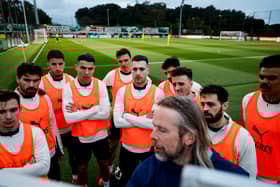 Cristiano Ronaldo and his Portugal teammates give their attention to assistant coach Austin MacPhee at the tactics board. Pic: Portuguese Football Federation