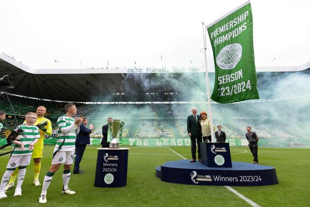 Celtic unfurl the league winners flag ahead of their opening William Hill Premiership match last season. (Photo by Craig Williamson / SNS Group)