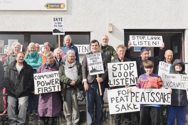   Ruraidh Stewart, centre, with residents from Skye gathering at the inquiry into the Ben Aketil wind farm this week