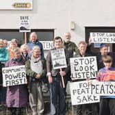   Ruraidh Stewart, centre, with residents from Skye gathering at the inquiry into the Ben Aketil wind farm this week