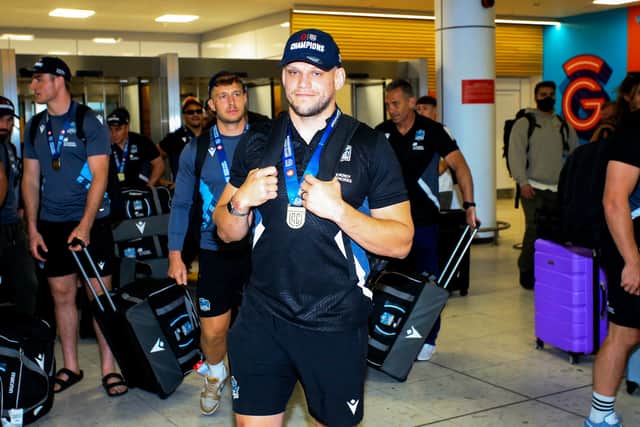 George Turner returns home last year with a URC winners' medal after helping Glasgow Warriors beat the Bulls in the final in South Africa.