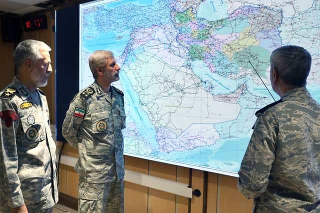 In this photo released on Monday by the Iranian army press service, Iran's army commander-in-chief Gen Amir Hatami, centre, Admiral Mahmoud Mousavi, right, and Admiral Habibollah Sayyari attend a meeting in Zolfaghar central headquarters, Iran