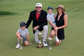 US Ryder Cup captain Keegan Bradley shows off the trophy along with his wife Jillian and sons Logan and Cooper after  winning the Travelers Championship at TPC River Highlands in Cromwell, Connecticut